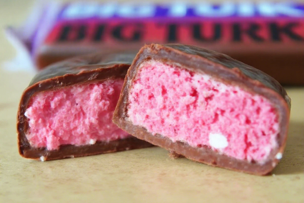 A cross-section of a Big Turk chocolate bar showing the Turkish delight filling and thin milk chocolate coating.