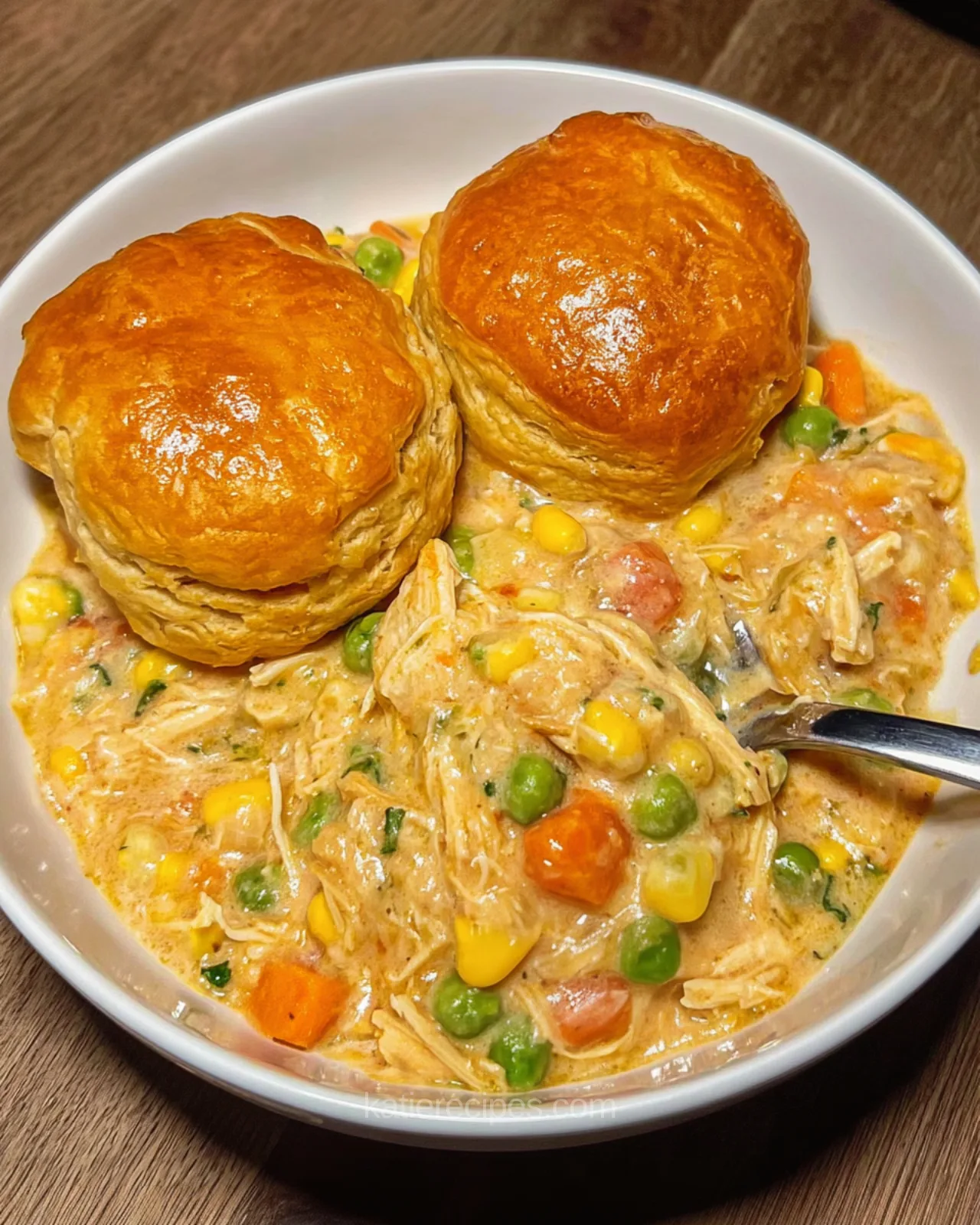 crockpot chicken pot pie stew with biscuits on top