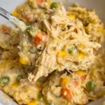 Crockpot chicken and stuffing casserole with melted cheese