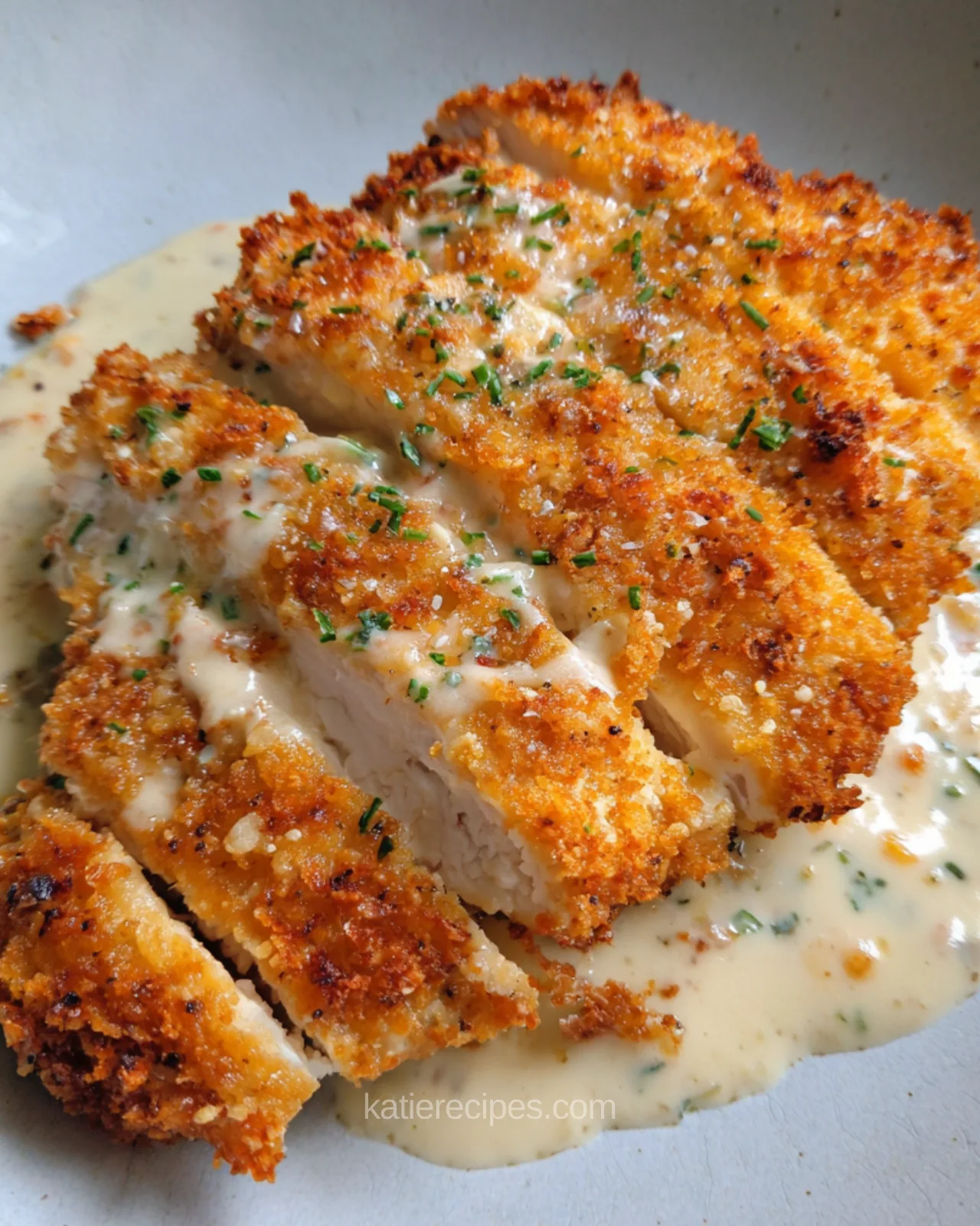 crispy parmesan chicken with creamy garlic sauce