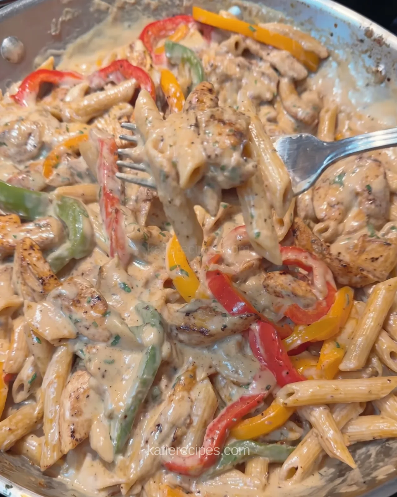 Creamy jerk chicken rasta pasta in a skillet
