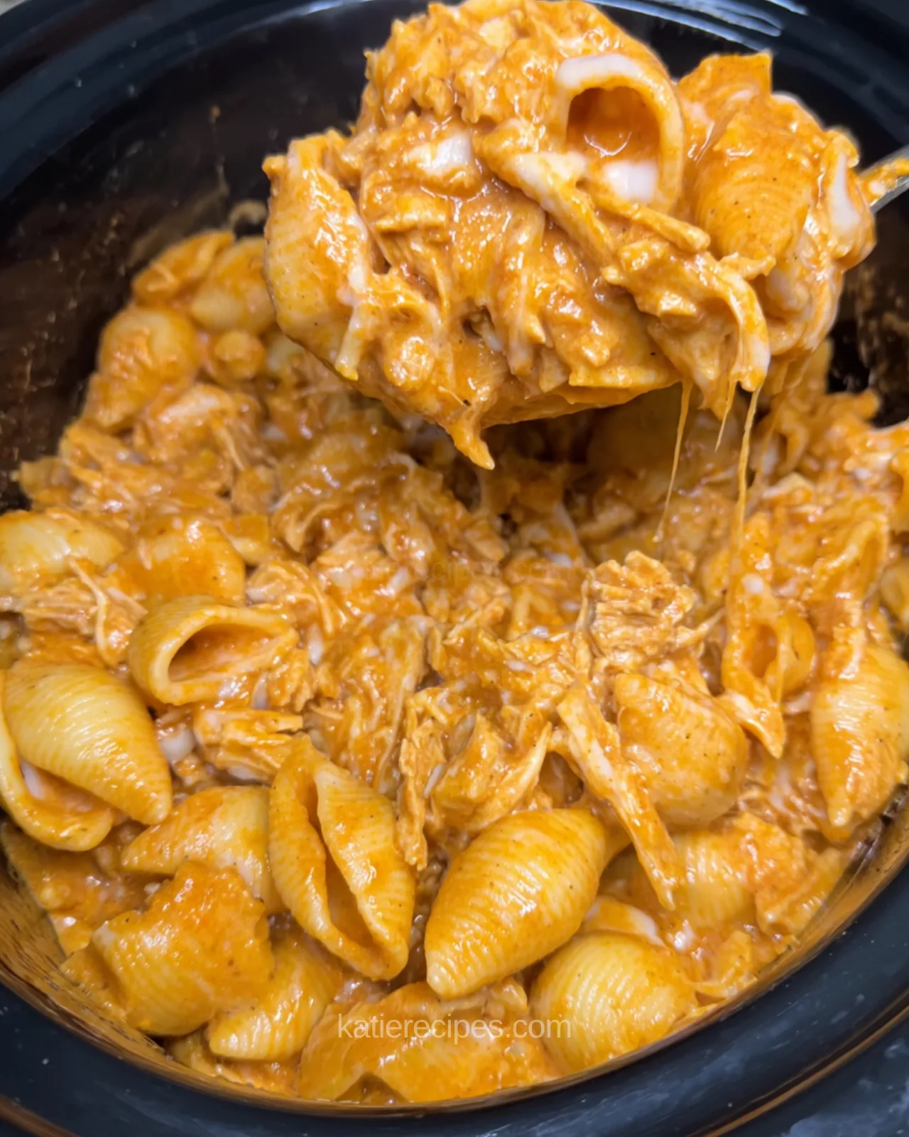 Creamy BBQ chicken mac and cheese made in the crockpot