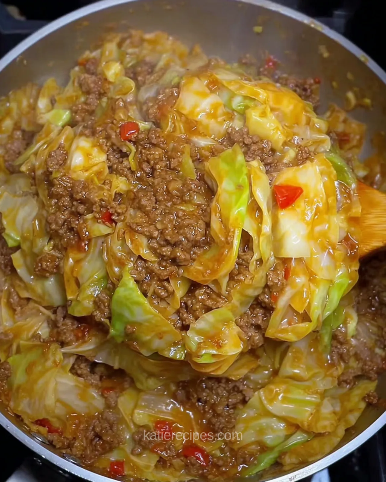 Close-up of cabbage skillet with beef and sausage tossed in gravy with bell peppers