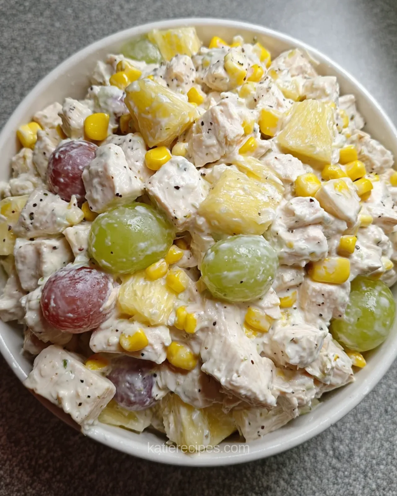 Royal delight salad with chicken, grapes, pineapple and corn after folding in the dressing